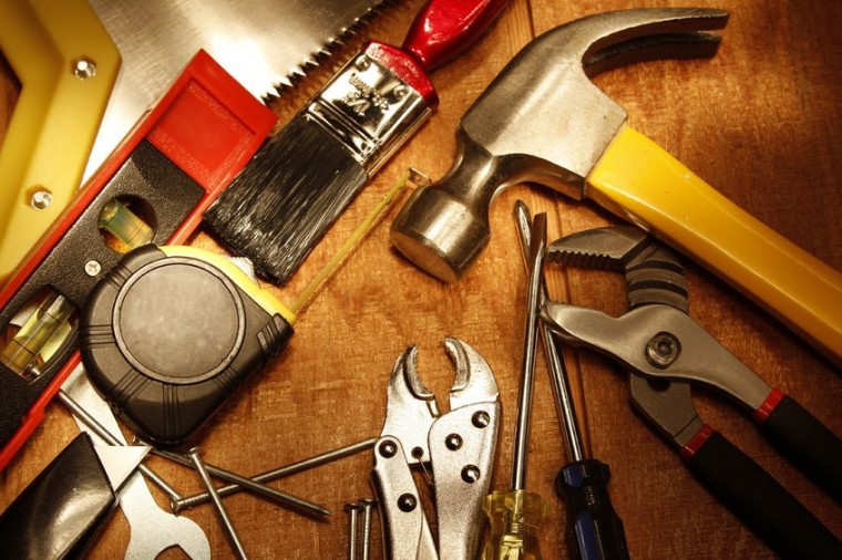 Assorted work tools on wood